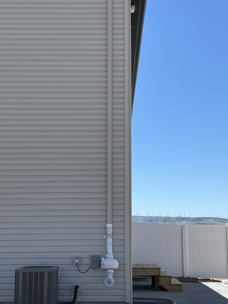 After: Exterior radon system with venting