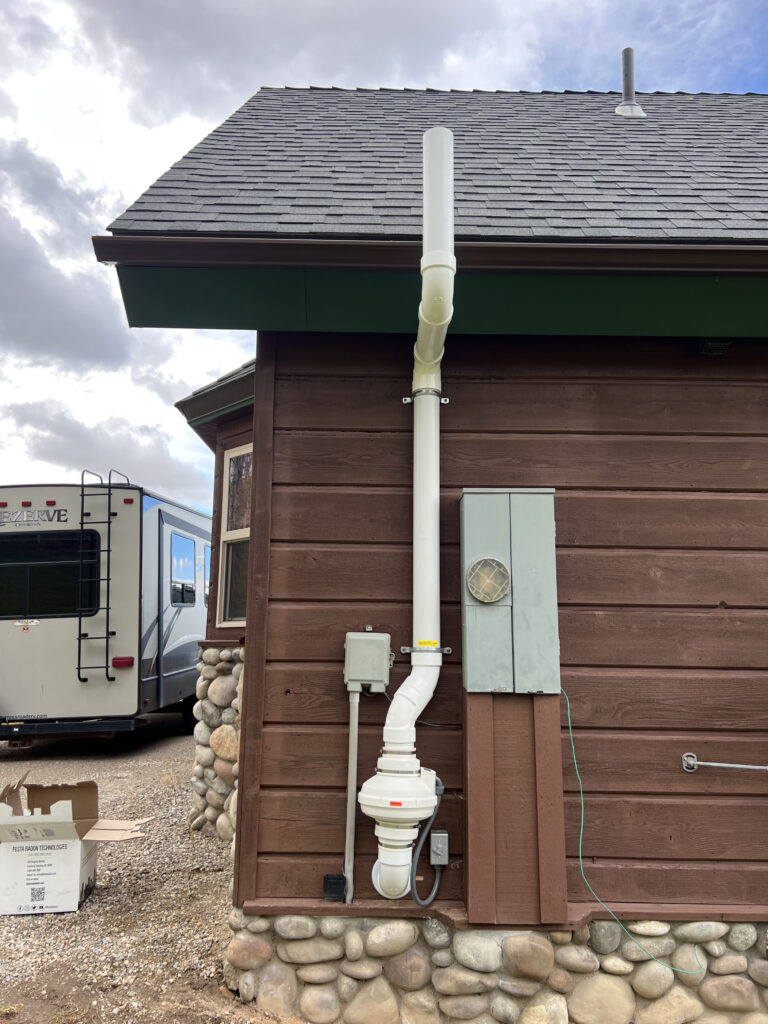After: Exterior radon system with PVC